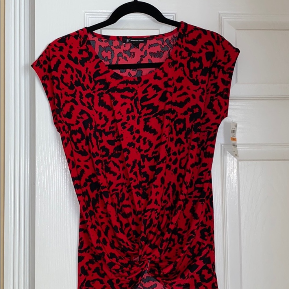 NEW INC Top